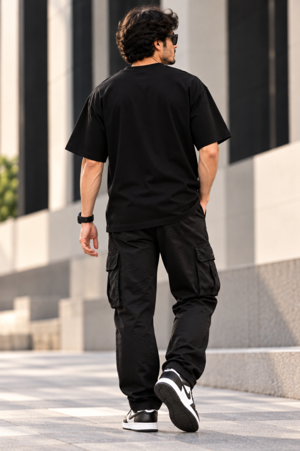Joe Vogue Oversized T-Shirt Back View Back view of model wearing a plain black oversized T-shirt