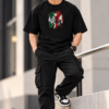 Joe Vogue Rule Your Reality T-Shirt Front Look Front view of model wearing black oversized Joe Vogue graphic T-shirt